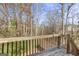 Wooden deck overlooking a wooded area at 119 Bombay Ln, Grantville, GA 30220