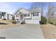 Two-story house with attached garage and red front door at 119 Bombay Ln, Grantville, GA 30220