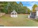 Spacious backyard with gazebo, screened porch, and fenced yard at 228 Otter Cir, Fayetteville, GA 30215