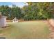 Large backyard with a gazebo and wooden fence at 228 Otter Cir, Fayetteville, GA 30215