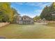 Spacious backyard showcasing a home and gazebo at 228 Otter Cir, Fayetteville, GA 30215