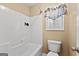 Clean bathroom with a tub shower combo and window at 228 Otter Cir, Fayetteville, GA 30215