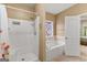 Bathroom with shower, garden tub and stained-glass window at 228 Otter Cir, Fayetteville, GA 30215