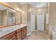 Bathroom with double vanity, tile flooring and separate tub and shower at 228 Otter Cir, Fayetteville, GA 30215