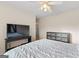 Well-lit bedroom with a flat-screen TV and built-in dresser at 228 Otter Cir, Fayetteville, GA 30215