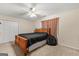 Bedroom with double doors and a ceiling fan at 228 Otter Cir, Fayetteville, GA 30215