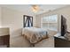 Cozy bedroom with a rustic wooden headboard and window blinds at 228 Otter Cir, Fayetteville, GA 30215