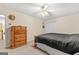 Simple bedroom with a wooden dresser and ceiling fan at 228 Otter Cir, Fayetteville, GA 30215