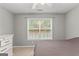 Serene bedroom featuring a large window and dresser at 228 Otter Cir, Fayetteville, GA 30215