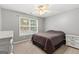 Bright bedroom with a queen bed and ample natural light at 228 Otter Cir, Fayetteville, GA 30215