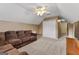 Spacious bonus room with a sectional sofa and double doors at 228 Otter Cir, Fayetteville, GA 30215