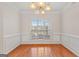 Formal dining room with hardwood floors and chandelier at 228 Otter Cir, Fayetteville, GA 30215
