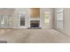 Gathering room with stone fireplace and access to backyard at 228 Otter Cir, Fayetteville, GA 30215