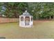 White gazebo in a lush green backyard setting at 228 Otter Cir, Fayetteville, GA 30215