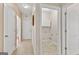Hallway with carpet and access to laundry and other rooms at 228 Otter Cir, Fayetteville, GA 30215