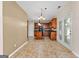 Kitchen features dark wood cabinets, an island, and tiled floor at 228 Otter Cir, Fayetteville, GA 30215