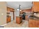 Kitchen boasts dark wood cabinets, granite counters, and an island at 228 Otter Cir, Fayetteville, GA 30215