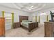 Spacious main bedroom with carpeted floors and large windows at 228 Otter Cir, Fayetteville, GA 30215