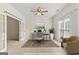 Well-lit office space featuring elegant French doors, a modern desk, and neutral tones for a productive atmosphere at 228 Otter Cir, Fayetteville, GA 30215