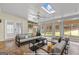 Bright sunroom with ample natural light, comfortable seating, and serene views of the backyard at 228 Otter Cir, Fayetteville, GA 30215