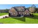 Two-story house with brick and siding, a covered porch, and a landscaped lawn at 250 Enfield Ln, Mcdonough, GA 30252