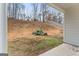 View of backyard with sloped terrain and some greenery at 10231 Deep Creek Pl, Union City, GA 30291