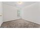 Well-lit bedroom with neutral carpeting and a window at 10231 Deep Creek Pl, Union City, GA 30291