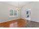 Dining area with hardwood floor and view into kitchen at 10231 Deep Creek Pl, Union City, GA 30291