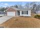 Two-car garage and front yard with landscaping at 10231 Deep Creek Pl, Union City, GA 30291