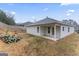 Rear view of house showcasing a covered patio and siding at 10231 Deep Creek Pl, Union City, GA 30291