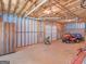 Unfinished basement with garage access and storage space at 925 Champions Way, Mcdonough, GA 30252