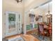 Elegant entryway with hardwood floors and a view of the dining area at 925 Champions Way, Mcdonough, GA 30252