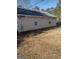 Tan house exterior with two windows and a grassy yard at 4031 S Old Fairburn Road S Rd, South Fulton, GA 30349