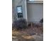 Side of house with window and overgrown bushes at 4031 S Old Fairburn Road S Rd, South Fulton, GA 30349