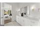 Beautiful bathroom with double vanity, marble countertops, modern fixtures, and access to the main bedroom at 220 Early Parkway Se Dr, Smyrna, GA 30082