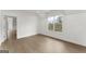 Bright bedroom featuring hardwood floors, a double window and ample space at 220 Early Parkway Se Dr, Smyrna, GA 30082