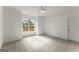 Neutral bedroom with a window overlooking the yard, carpeted floors, and white trim at 220 Early Parkway Se Dr, Smyrna, GA 30082
