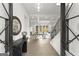 Bright, open foyer with hardwood floors, modern decor, and a view into the spacious living area at 220 Early Parkway Se Dr, Smyrna, GA 30082