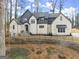 Beautiful home with a combination of painted brick and gray board and batten at 220 Early Parkway Se Dr, Smyrna, GA 30082
