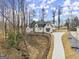 Stunning two-story home with an immaculate exterior, a long drive way, and a well-manicured lawn at 220 Early Parkway Se Dr, Smyrna, GA 30082
