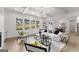 Stylish living room featuring coffered ceilings, large windows, and modern furnishings at 220 Early Parkway Se Dr, Smyrna, GA 30082