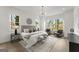 This spacious main bedroom features large windows, stylish decor, and a comfortable seating area at 220 Early Parkway Se Dr, Smyrna, GA 30082