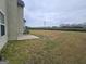 Expansive backyard featuring a concrete patio and mature landscaping; perfect for outdoor activities and relaxation at 7214 Bedrock Cir, Lithonia, GA 30038
