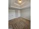 This bedroom features double closets, neutral walls, and plush carpeting at 7214 Bedrock Cir, Lithonia, GA 30038