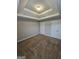 This bedroom features plush carpeting, neutral walls and a modern trey ceiling at 7214 Bedrock Cir, Lithonia, GA 30038
