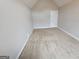 This cozy bedroom offers neutral walls and plush carpeting throughout at 7214 Bedrock Cir, Lithonia, GA 30038