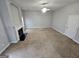 Spacious living room with plush carpet, fireplace, and neutral tones for a warm, inviting atmosphere at 7214 Bedrock Cir, Lithonia, GA 30038