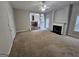 Large living room with neutral carpet, fireplace, and open layout perfect for entertaining guests at 7214 Bedrock Cir, Lithonia, GA 30038