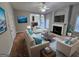 Inviting living room featuring stylish furnishings, a cozy fireplace, and abundant natural light at 7214 Bedrock Cir, Lithonia, GA 30038