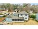 Aerial view of house, showcasing backyard, screened porch, and neighborhood setting at 103 Sandtrap Rdg, Peachtree City, GA 30269